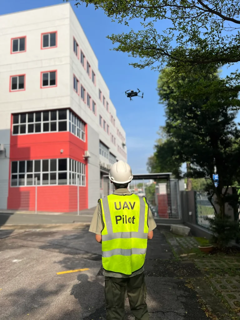 UAV pilot preparing drone facade inspection scaled